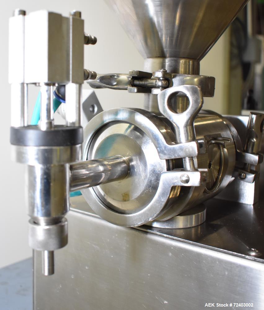 Used Wenzhou Rigao Table Top Semi Automatic Piston Filler, Model DYF. 316L Stainless steel product contact. Filling speed 5 to 20 bottles per minute. Filling accuracy /= 1% +/-. Filling range: approx...